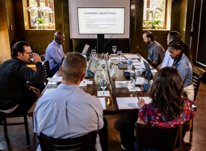 C12 CEO peer advisory group members meeting at monthly forum.